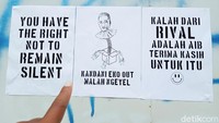Salah satu poster bertuliskan Kandani Eko Out Malah Ngeyel.