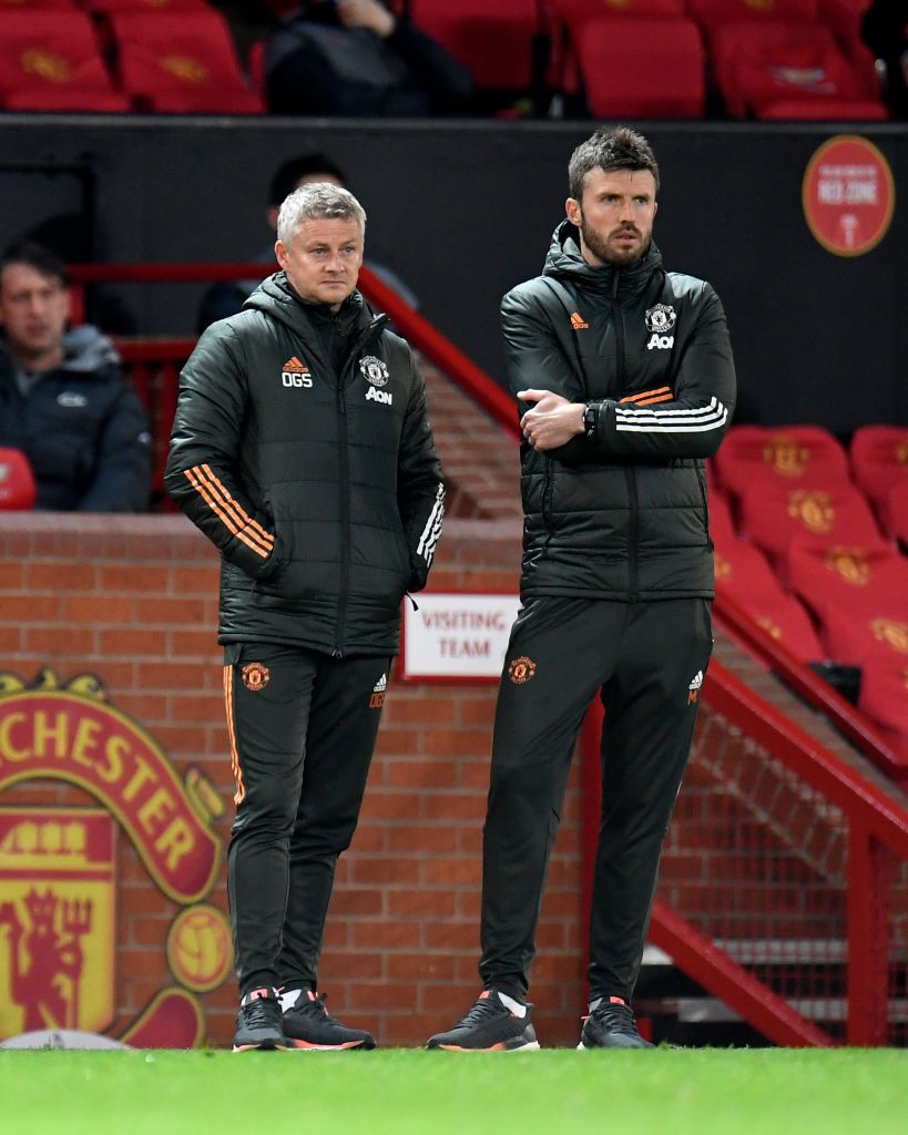 MANCHESTER, ENGLAND - MAY 13: Ole Gunnar Solskjaer, Manager of Manchester United and Michael Carrick, First Team Coach look on during the Premier League match between Manchester United and Liverpool at Old Trafford on May 13, 2021 in Manchester, England. Sporting stadiums around the UK remain under strict restrictions due to the Coronavirus Pandemic as Government social distancing laws prohibit fans inside venues resulting in games being played behind closed doors. (Photo by Peter Powell - Pool/Getty Images)