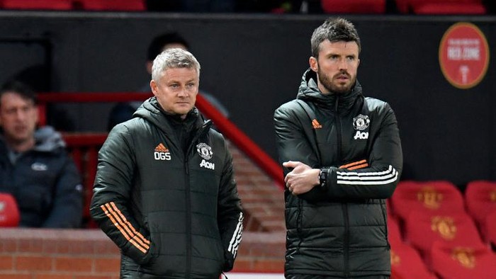 MANCHESTER, ENGLAND - MAY 13: Ole Gunnar Solskjaer, Manager of Manchester United and Michael Carrick, First Team Coach look on during the Premier League match between Manchester United and Liverpool at Old Trafford on May 13, 2021 in Manchester, England. Sporting stadiums around the UK remain under strict restrictions due to the Coronavirus Pandemic as Government social distancing laws prohibit fans inside venues resulting in games being played behind closed doors. (Photo by Peter Powell - Pool/Getty Images)