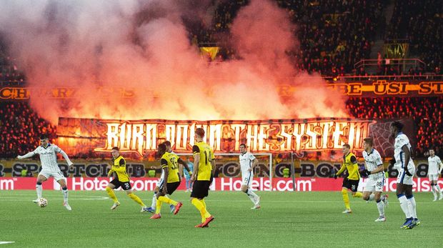 Young Boys' fans release flares, during the Group F Champions League soccer match between Young Boys and Atalanta at the Wankdorf stadium in Bern, Switzerland, Tuesday, Nov. 23, 2021. (Peter Klaunzer/Keystone via AP)