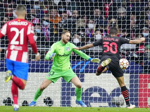 AC Milan's Junior Messias, right, scores the opening goal during a Group B Champions League soccer match between Atletico Madrid and AC Milan at the Wanda Metropolitano stadium in Madrid, Spain, Wednesday, Nov. 24, 2021. (AP Photo/Manu Fernandez)