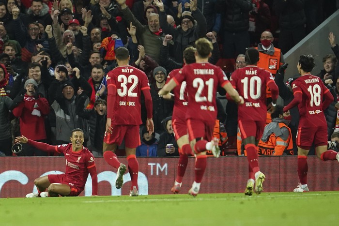 Liverpools Thiago, left, celebrates after scoring his sides opening goal during the Champions League group B soccer match between Liverpool and FC Porto at Anfield stadium in Liverpool, Wednesday, Nov. 24, 2021. (AP Photo/Jon Super)