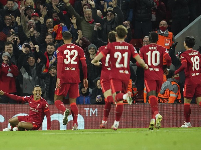 Liverpools Thiago, left, celebrates after scoring his sides opening goal during the Champions League group B soccer match between Liverpool and FC Porto at Anfield stadium in Liverpool, Wednesday, Nov. 24, 2021. (AP Photo/Jon Super)