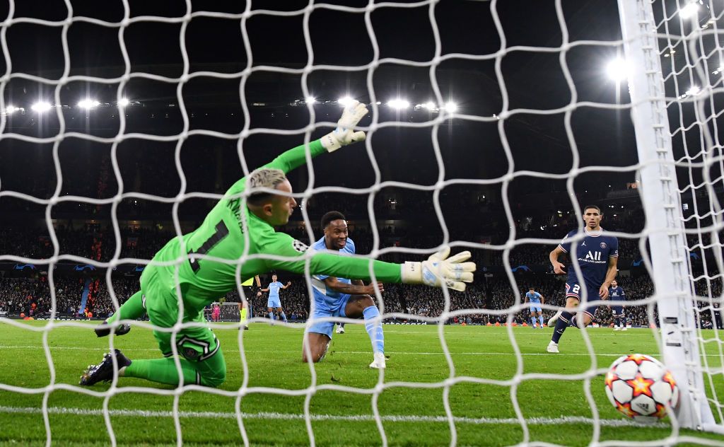 MANCHESTER, ENGLAND - NOVEMBER 24: Raheem Sterling of Manchester City scores their team's first goal past Keylor Navas of Paris Saint-Germain during the UEFA Champions League group A match between Manchester City and Paris Saint-Germain at Etihad Stadium on November 24, 2021 in Manchester, England. (Photo by Shaun Botterill/Getty Images)