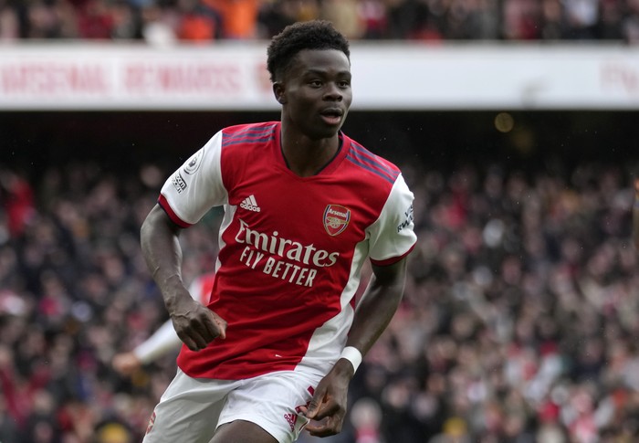Arsenals Bukayo Saka celebrates after scoring his sides opening goal during the English Premier League soccer match between Arsenal and Newcastle United at Emirates stadium in London, Saturday, Nov. 27, 2021. (AP Photo/Kirsty Wigglesworth)
