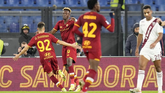 Romas Tammy Abraham, 2nd left, celebrates after scoring his sides first goal during the Serie A soccer match between Roma and Torino at Romes Olympic stadium, Sunday, Nov. 28, 2021. (AP Photo/Gregorio Borgia)