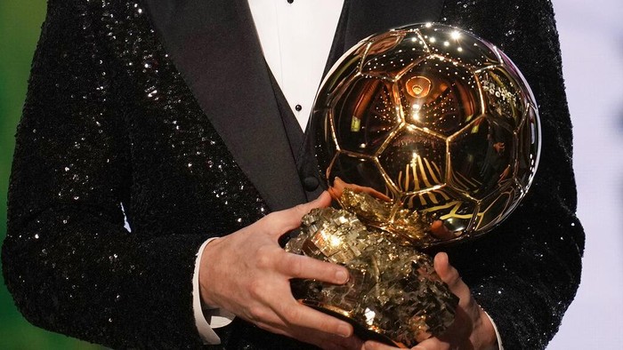 PSG player Lionel Messi holds the 2021 Ballon dOr trophy during the 65th Ballon dOr ceremony at Theatre du Chatelet, in Paris, Monday, Nov. 29, 2021. Messi won the Ballon dOr for seventh time. (AP Photo/Christophe Ena)