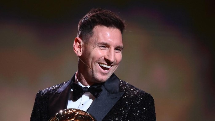 Paris Saint-Germains Argentine forward Lionel Messi reacts after being awarded the the Ballon dOr award during the 2021 Ballon dOr France Football award ceremony at the Theatre du Chatelet in Paris on November 29, 2021. (Photo by FRANCK FIFE / AFP)