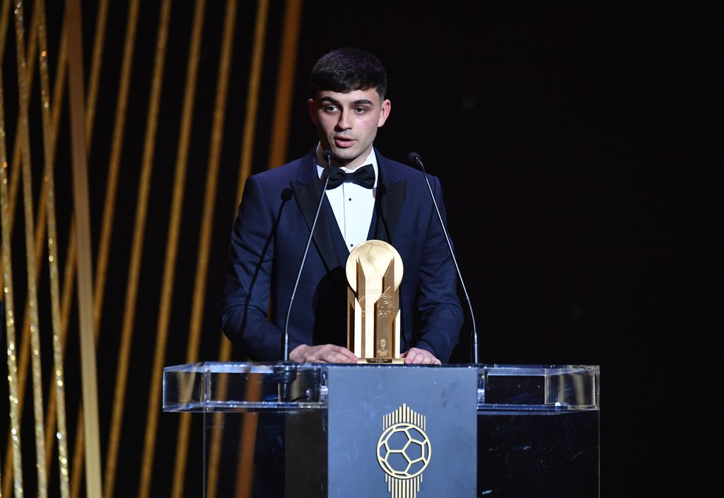 PARIS, FRANCE - NOVEMBER 29: Pedri Gonzalez (ES/FC Barcelona) is awarded with the Kopa Trophy during the the Ballon D'Or ceremony at Theatre du Chatelet on November 29, 2021 in Paris, France. (Photo by Aurelien Meunier/Getty Images)