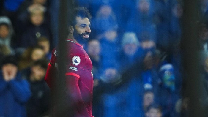 Liverpools Mohamed Salah celebrates after scoring his sides second goal during the English Premier League soccer match between Everton and Liverpool at Goodison Park in Liverpool, England, Wednesday, Dec. 1, 2021. (AP Photo/Jon Super)