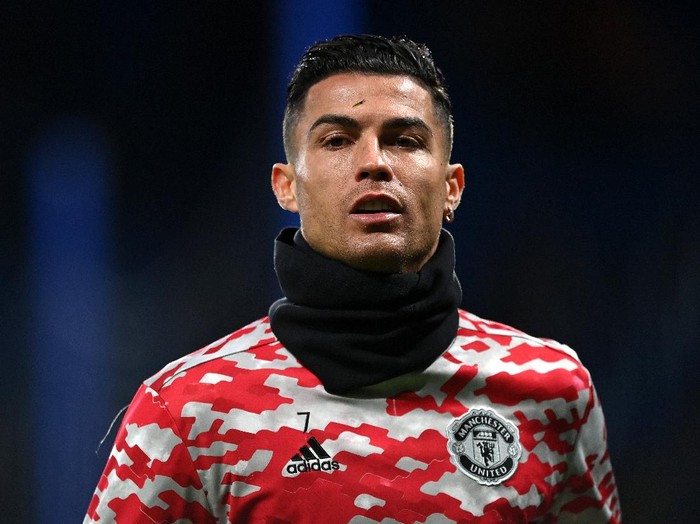 LONDON, ENGLAND - NOVEMBER 28: Cristiano Ronaldo of Manchester United looks on as he warms up prior to the Premier League match between Chelsea and Manchester United at Stamford Bridge on November 28, 2021 in London, England. (Photo by Shaun Botterill/Getty Images )