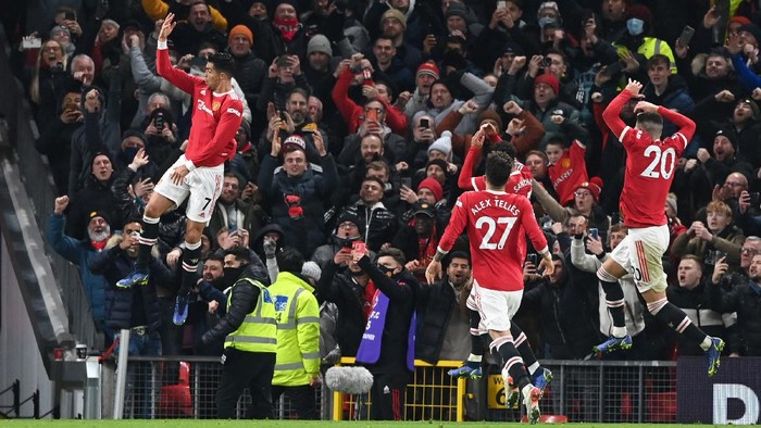 MANCHESTER, ENGLAND - DECEMBER 02: Cristiano Ronaldo of Manchester United celebrates after scoring their sides third goal during the Premier League match between Manchester United and Arsenal at Old Trafford on December 02, 2021 in Manchester, England. (Photo by Shaun Botterill/Getty Images)