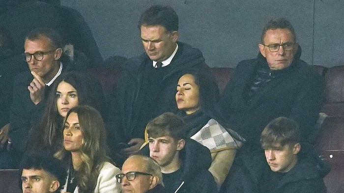 New interim Manchester United manager Ralf Rangnick, top right, watches from the stands during the English Premier League soccer match between Manchester United and Arsenal at Old Trafford stadium in Manchester, England, Thursday, Dec. 2, 2021. (AP Photo/Dave Thompson)