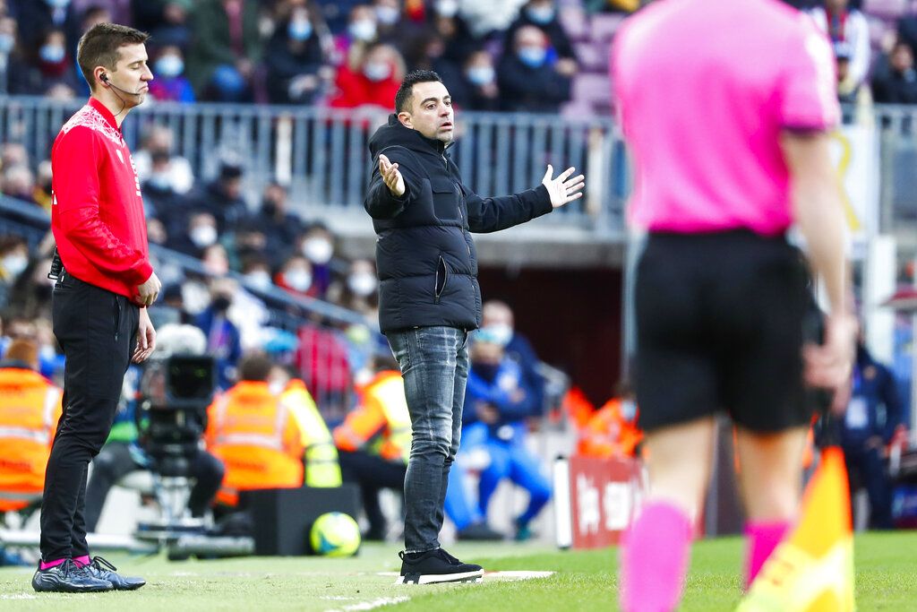 Barcelona's Ousmane Dembele gestures during the Spanish La Liga soccer match between Barcelona and Real Betis at the Camp Nou stadium, in Barcelona, Spain, Saturday, Dec. 4, 2021. (AP Photo/Joan Monfort)