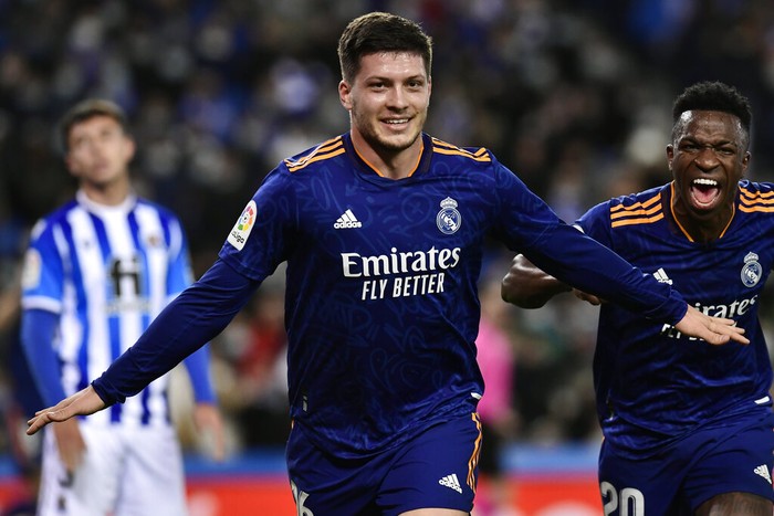 Real Madrids Luka Jovic celebrates with Vinicius Junior, right, after scoring their sides second goal during the Spanish La Liga soccer match between Real Sociedad and Real Madrid at Reale Arena stadium in San Sebastian, Spain, Saturday, Dec. 4, 2021. (AP Photo/Alvaro Barrientos)