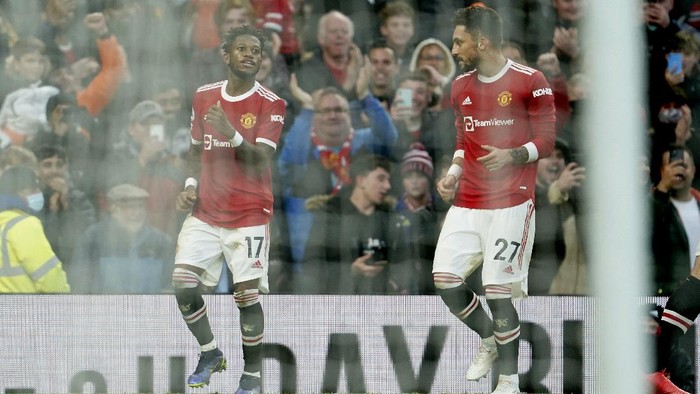 Manchester Uniteds Fred, left, celebrates after scoring his sides opening goal during the English Premier League soccer match between Manchester United and Crystal Palace at Old Trafford stadium in Manchester, England, Sunday, Dec. 5, 2021. (AP Photo/Jon Super)