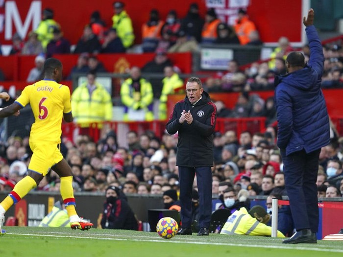 Crystal Palace's head coach Patrick Vieira, right, and Manchester United's manager Ralf Rangnick during the English Premier League soccer match between Manchester United and Crystal Palace at Old Trafford stadium in Manchester, England, Sunday, Dec. 5, 2021. (AP Photo/Jon Super)