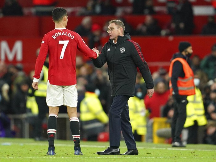 Manchester United's manager Ralf Rangnick shakes hands with Manchester United's Cristiano Ronaldo at the end of the English Premier League soccer match between Manchester United and Crystal Palace at Old Trafford stadium in Manchester, England, Sunday, Dec. 5, 2021. (AP Photo/Jon Super)