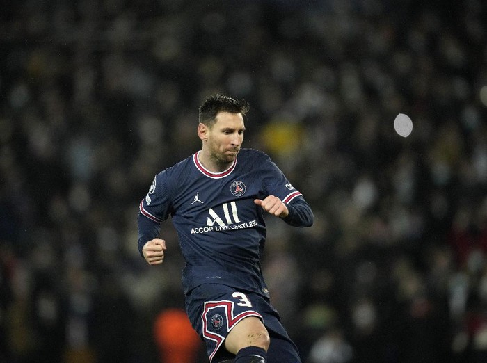 PSG's Lionel Messi celebrates after scoring his side's fourth goal during the Champions League Group A soccer match between PSG and Club Brugge at the Parc des Princes stadium in Paris, France, Tuesday, Dec. 7, 2021. (AP Photo/Christophe Ena)
