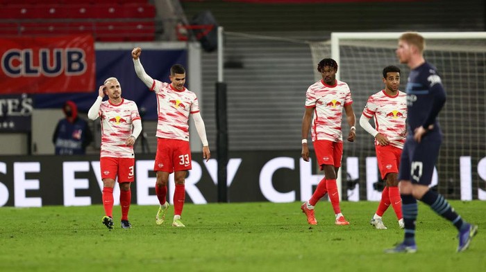 LEIPZIG, GERMANY - DECEMBER 07: Andre Silva of RB Leipzig celebrates after scoring their sides second goal during the UEFA Champions League group A match between RB Leipzig and Manchester City at Red Bull Arena on December 07, 2021 in Leipzig, Germany. (Photo by Maja Hitij/Getty Images)