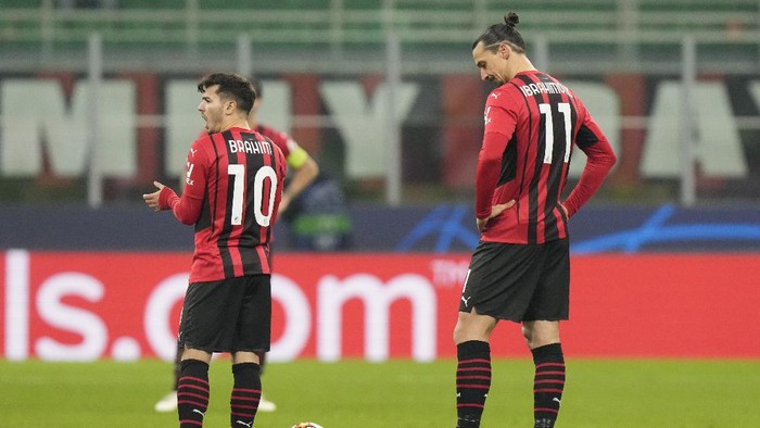 AC Milans Zlatan Ibrahimovic, right, and AC Brahim Diaz react after the second goal against their team during the Champions League, Group B soccer match between AC Milan and Liverpool at the San Siro stadium in Milan, Italy, Tuesday, Dec. 7, 2021. (AP Photo/Luca Bruno)
