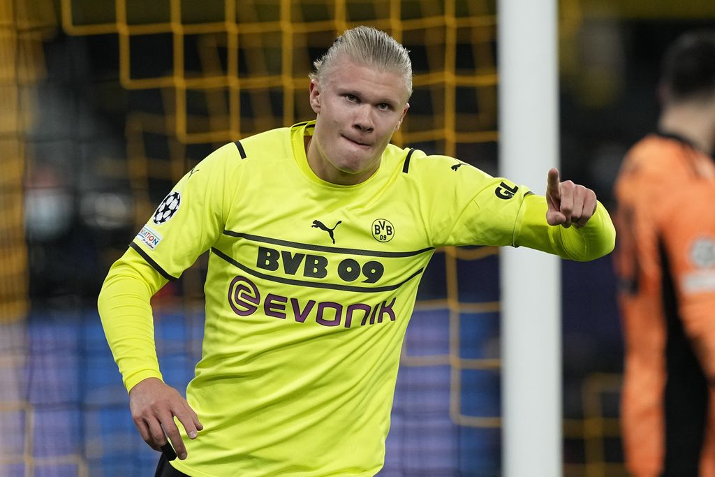 Dortmund's Erling Haaland, celebrates after he scores his second goal and his side's fifth goal of the game during the Champions League Group C soccer match between Borussia Dortmund and Besiktas Istanbul in Dortmund, Germany, Tuesday, Dec. 7, 2021. (AP Photo/Martin Meissner)