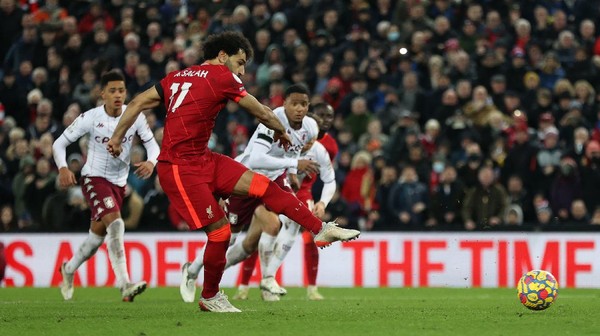 LIVERPOOL, ENGLAND - DECEMBER 11: Mohamed Salah of Liverpool scores their sides first goal from the penalty spot during the Premier League match between Liverpool and Aston Villa at Anfield on December 11, 2021 in Liverpool, England. (Photo by Clive Brunskill/Getty Images)