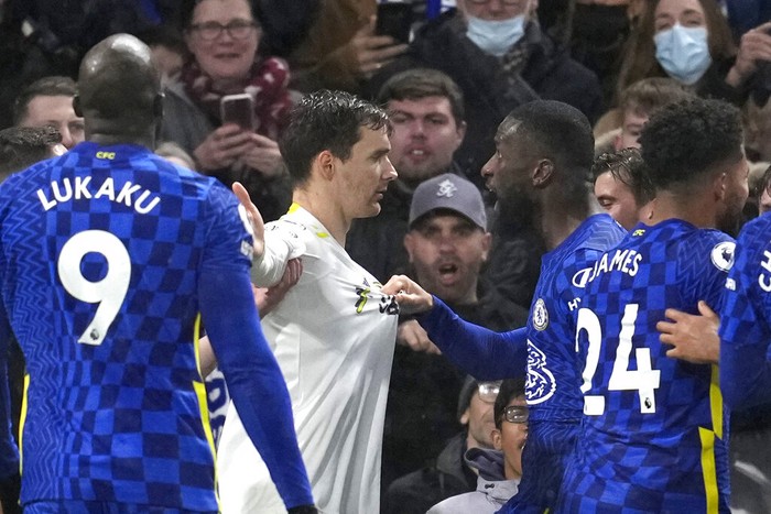 Chelseas Antonio Rudiger, right, argues with Leeds Uniteds Luke Ayling at the end of the English Premier League soccer match between Chelsea and Leeds United, at the Stamford Bridge stadium in London, Saturday, Dec.11, 2021. (AP Photo/Matt Dunham)