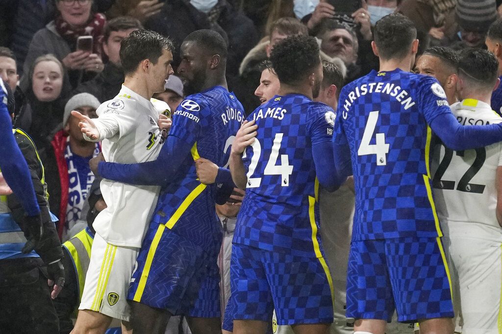 Chelsea's Antonio Rudiger, right, argues with Leeds United's Luke Ayling at the end of the English Premier League soccer match between Chelsea and Leeds United, at the Stamford Bridge stadium in London, Saturday, Dec.11, 2021. (AP Photo/Matt Dunham)