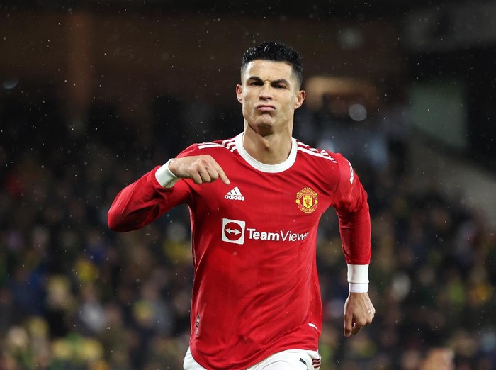 NORWICH, ENGLAND - DECEMBER 11: Cristiano Ronaldo of Manchester United celebrates after scoring his sides first goal from the penalty spot during the Premier League match between Norwich City and Manchester United at Carrow Road on December 11, 2021 in Norwich, England. (Photo by Alex Pantling/Getty Images)