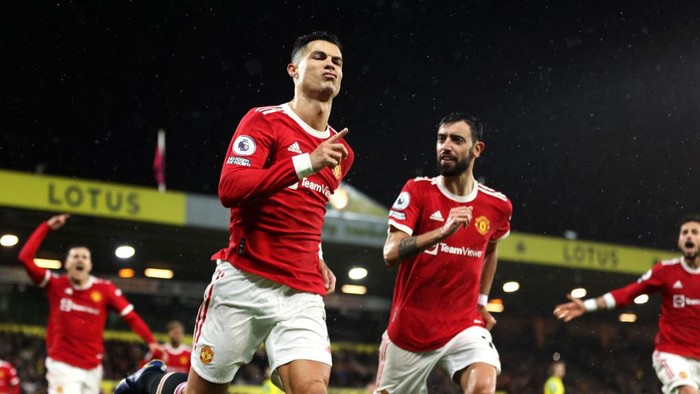 NORWICH, ENGLAND - DECEMBER 11: Cristiano Ronaldo of Manchester United celebrates after scoring his sides first goal from the penalty spot during the Premier League match between Norwich City and Manchester United at Carrow Road on December 11, 2021 in Norwich, England. (Photo by Alex Pantling/Getty Images)