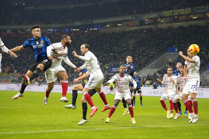 Inter Milans Lautaro Martinez, left, heads the ball to score his sides first goal during a Serie A soccer match between Inter Milan and Cagliari at the San Siro stadium in Milan, Italy, Sunday, Dec.12, 2021. (AP Photo/Luca Bruno)