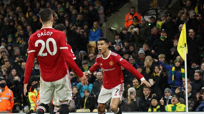 NORWICH, ENGLAND - DECEMBER 11: Cristiano Ronaldo of Manchester United celebrates after scoring their sides first goal during the Premier League match between Norwich City and Manchester United at Carrow Road on December 11, 2021 in Norwich, England. (Photo by Alex Pantling/Getty Images)