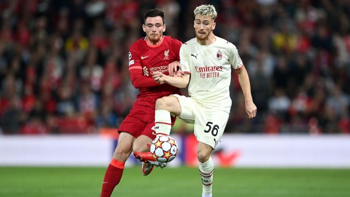 LIVERPOOL, ENGLAND - SEPTEMBER 15: Alexis Saelemaekers of AC Milan is challenged by Andrew Robertson of Liverpool during the UEFA Champions League group B match between Liverpool FC and AC Milan at Anfield on September 15, 2021 in Liverpool, England. (Photo by Shaun Botterill/Getty Images)