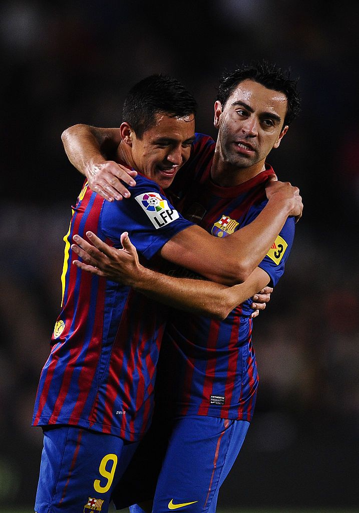 BARCELONA, SPAIN - APRIL 10:  Alexis Sanchez of FC Barcelona (L) celebrates with his teammate Xavi Hernandez of FC Barcelona after scoring the opening goal lduring the La Liga match between FC Barcelona and Getafe CF at Camp Nou on April 10, 2012 in Barcelona, Spain.  (Photo by David Ramos/Getty Images)