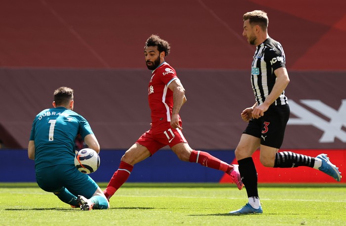 LIVERPOOL, ENGLAND - APRIL 24: Mohamed Salah of Liverpool has his shot saved by Martin Dubravka of Newcastle United during the Premier League match between Liverpool and Newcastle United at Anfield on April 24, 2021 in Liverpool, England. Sporting stadiums around the UK remain under strict restrictions due to the Coronavirus Pandemic as Government social distancing laws prohibit fans inside venues resulting in games being played behind closed doors.  (Photo by David Klein - Pool/Getty Images)