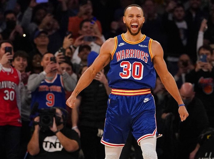 Golden State Warriors guard Stephen Curry reacts after scoring a 3-point basket during the first half of an NBA basketball game against the New York Knicks, Tuesday, Dec. 14, 2021, at Madison Square Garden in New York. Curry hit his 2,974th 3-pointer Tuesday night in the first quarter of the Golden State Warriors' game against the New York Knicks, breaking the record set by Ray Allen. (AP Photo/Mary Altaffer)