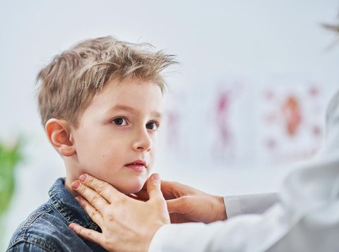 Picture of little boy having medical examination by pediatrician