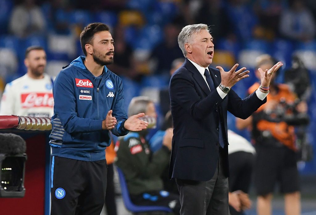 NAPLES, ITALY - OCTOBER 19: Carlo Ancelotti coach of SSC Napoli and his son Davide Ancelotti assistant coach of SSC Napoli during the Serie A match between SSC Napoli and Hellas Verona at Stadio San Paolo on October 19, 2019 in Naples, Italy. (Photo by Francesco Pecoraro/Getty Images)
