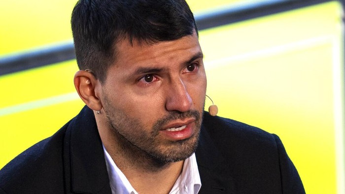 Barcelona striker Sergio Aguero cries during a press conference at the Camp Nou stadium in Barcelona, Spain, Wednesday, Dec. 15, 2021. Sergio Aguero has announced his retirement from football on Wednesday due to a heart condition. (AP Photo/Emilio Morenatti)