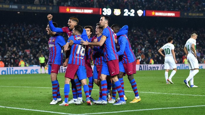 BARCELONA, SPAIN - DECEMBER 18: Nico Gonzalez of FC Barcelona  celebrates with teammates after scoring their teams third goal  during the LaLiga Santander match between FC Barcelona and Elche CF at Camp Nou on December 18, 2021 in Barcelona, Spain. (Photo by Alex Caparros/Getty Images)