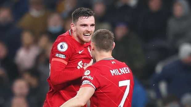 LONDON, ENGLAND - DECEMBER 19: Andrew Robertson of Liverpool celebrates after scoring their side's second goal with James Milner during the Premier League match between Tottenham Hotspur and Liverpool at Tottenham Hotspur Stadium on December 19, 2021 in London, England. (Photo by Alex Pantling/Getty Images )