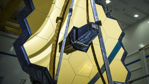 This March 5, 2020 photo made availalble by NASA shows the main mirror assembly of the James Webb Space Telescope during testing at a Northrop Grumman facility in Redondo Beach, Calif. Webb will attempt to look back in time 13.7 billion years, a mere 100 million years after the universe-forming Big Bang as the original stars were forming. (Chris Gunn/NASA via AP)
