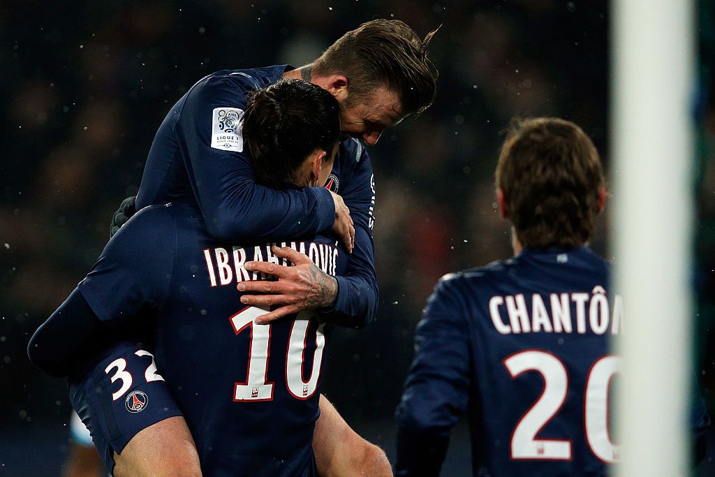 PARIS, FRANCE - MAY 18:  Zlatan Ibrahimovic of PSG celebrates with team mate David Beckham after scoring to make it 3-0 during the Ligue 1 match between Paris Saint-Germain FC and Stade Brestois 29 at Parc des Princes on May 18, 2013 in Paris, France.  (Photo by Michael Regan/Getty Images)