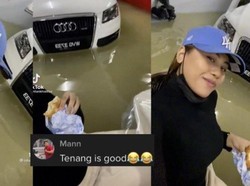 Mobil Mewahnya Terendam Banjir, Wanita Ini Malah Nyantai Makan Burger 