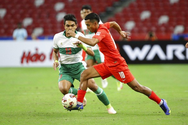 Ikhsan Fandi of Singapore, right, celebrates after scoring the equaliser during the AFF Suzuki Cup 2020 semi-final first leg soccer match between Singapore and Indonesia in Singapore, Wednesday, Dec. 22, 2021. (AP Photo/Suhaimi Abdullah)
