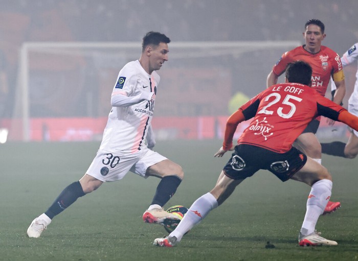 Lionel Messi PSG's Lionel Messi, left, and Lorient's Vincent Le Goff challenge for the ball during the French League One soccer match between FC Lorient and Paris Saint-Germain at the Moustoir stadium in Lorient, western France, Wednesday, Dec. 22, 2021. (AP Photo/Jeremias Gonzalez)
