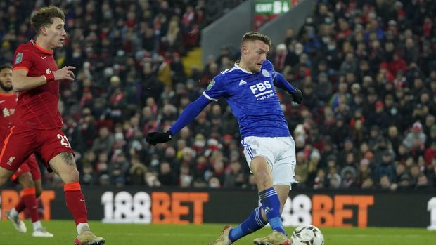 Leicester's Jamie Vardy shoots to score his sides second goal during the English League Cup quarter-final soccer match between Liverpool and Leicester City, at Anfield Stadium, in Liverpool, England, Wednesday Dec. 22, 2021. (AP Photo/Jon Super)