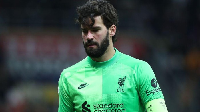 MILAN, ITALY - DECEMBER 07: Alisson Becker of Liverpool FC looks on during the UEFA Champions League group B match between AC Milan and Liverpool FC at Giuseppe Meazza Stadium on December 07, 2021 in Milan, Italy. (Photo by Marco Luzzani/Getty Images)