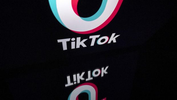 This photo taken on November 21, 2019, shows the logo of the social media video sharing app Tiktok displayed on a tablet screen in Paris. (Photo by Lionel BONAVENTURE / AFP)